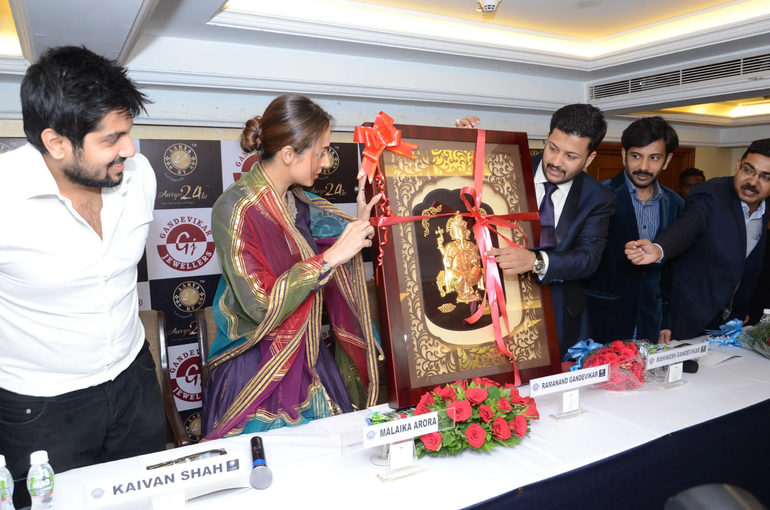 ITT event entrance with red and green carpet and pink lighting on white structure with ITT branding